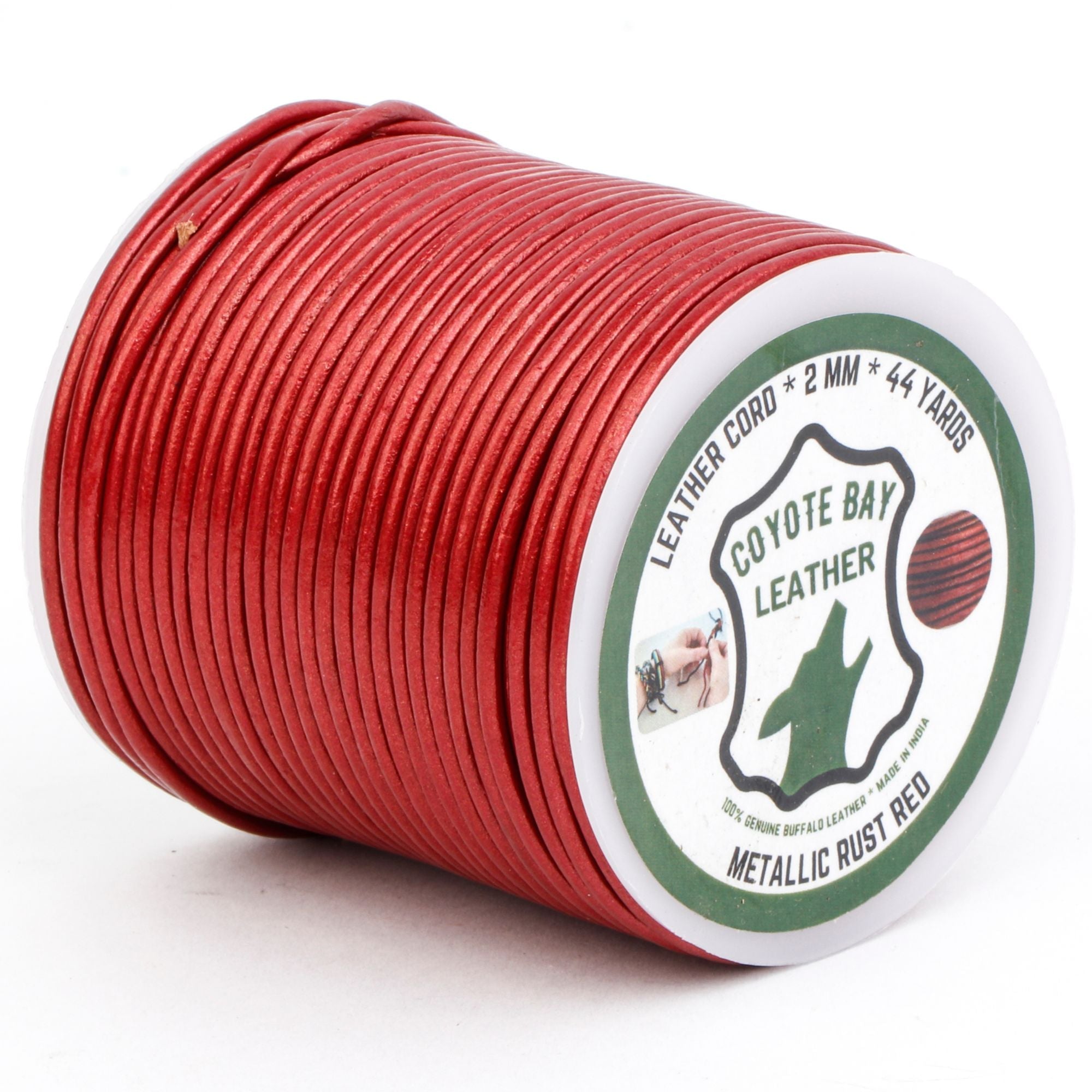 Spool of red leather cord with Coyote Bay Leather label on a white background