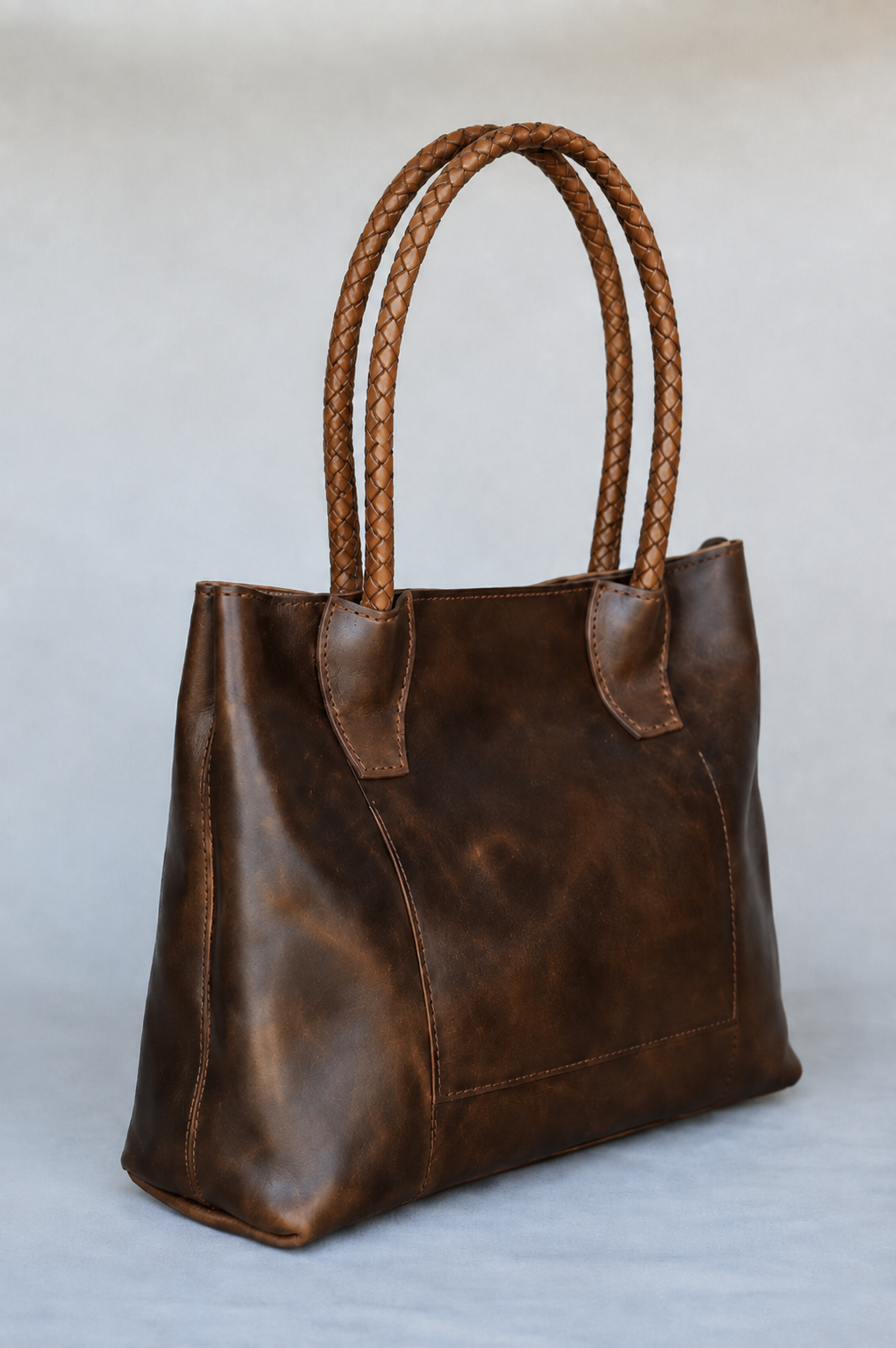 Leather tote bag with round braided leather strap handles